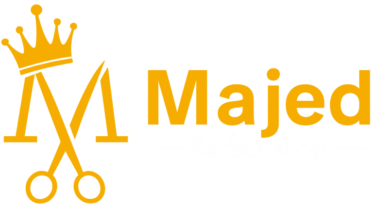 Logotipo dorado de Majed Barber Shop con tijeras estilizadas.